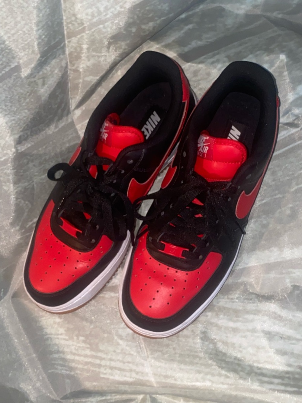 Nike low top sneakers in red and black